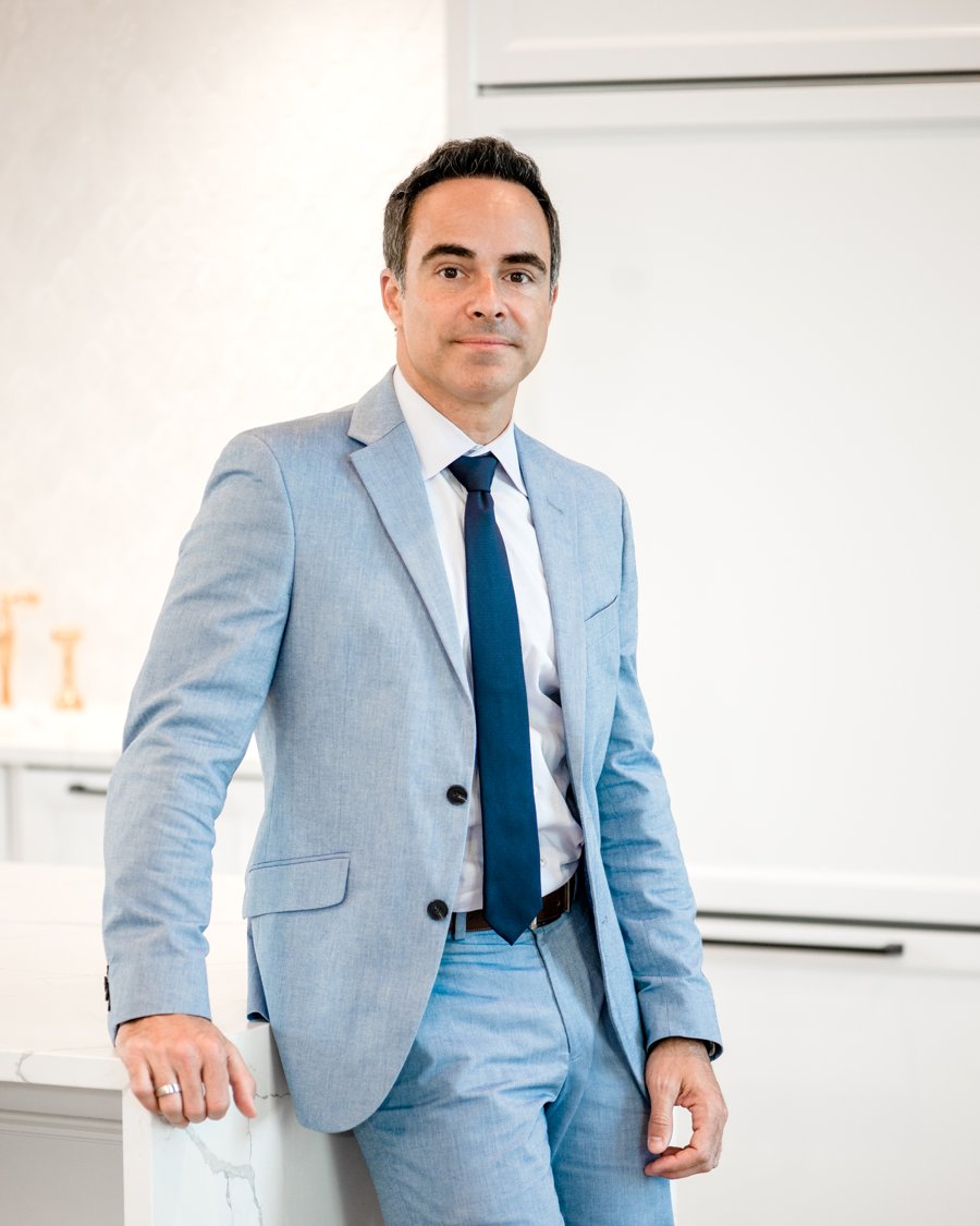 Carlos Puente in a kitchen from a home his team built
